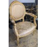 Paire de fauteuils style Louis XVI dorés
