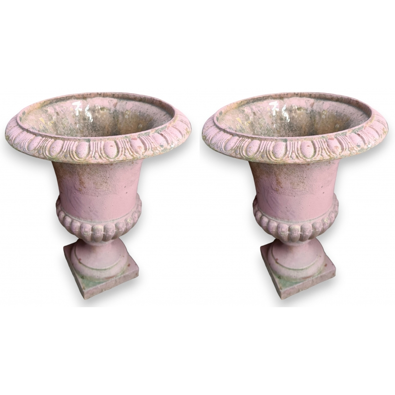 Pair of pink cast-iron urns