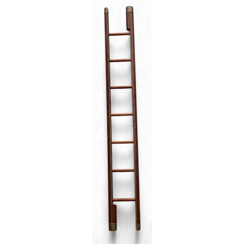 Retractable bookcase ladder in brown leather