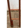 Retractable bookcase ladder in brown leather
