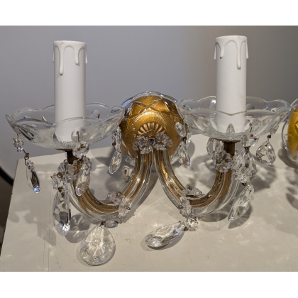 A pair of two-light glass wall lights