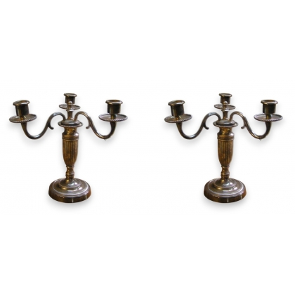Pair of Louis XVI-style candlesticks. Available from Moinat SA – Antiques and home décor