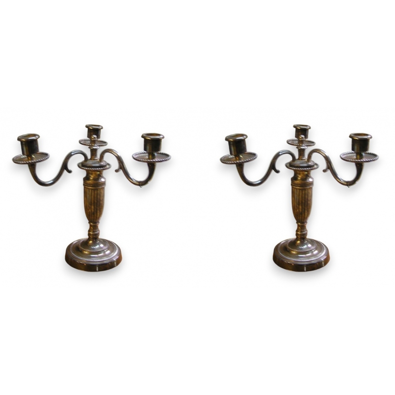 Pair of Louis XVI-style candlesticks. Available from Moinat SA – Antiques and home décor