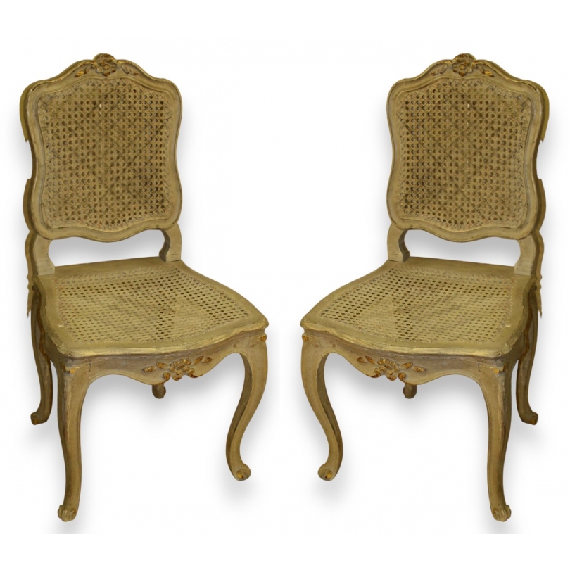 A pair of lacquered and cane-seated Louis XV chairs. Available from  Moinat SA  - Antiques and home décor