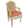 Regency-style cane-upholstered armchair in wood at  Moinat SA  - Antiques and home décor