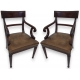 Paire de fauteuils, en acajou. Assise en cuir brun