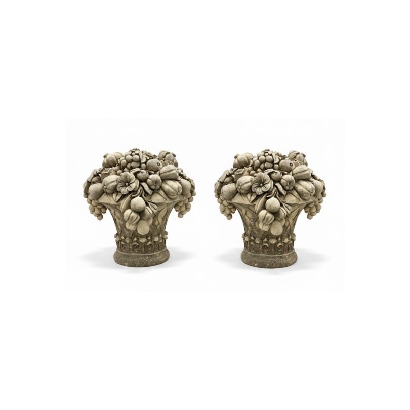 A pair of carved stone fruit bowls
