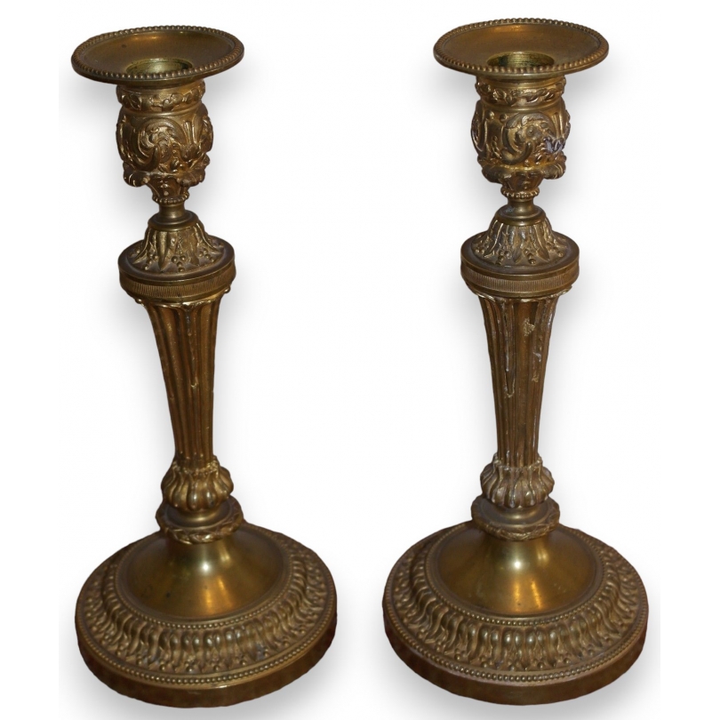  Paire de bougeoirs Louis XVI en bronze sur  Moinat SA  - Antiquités décoration