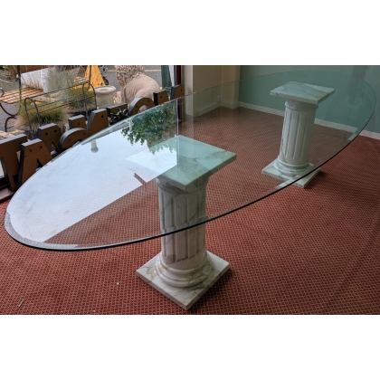 Table ovale plateau verre et colonnes marbre