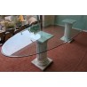 Table ovale plateau verre et colonnes marbre