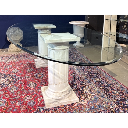 Table ovale plateau verre et colonnes marbre