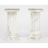 Table ovale plateau verre et colonnes marbre