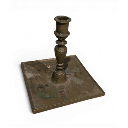 Bronze candle holder with a square base