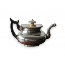 Silver teapot and wood handle