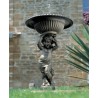  Fontaine en fonte "Angelot" sur  Moinat SA  - Antiquités décoration