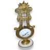 Louis XVI ‘Lyre’ clock in gilded bronze at Moinat SA – Antiques and home décor