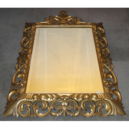 Espejo italiano tallado, de madera dorada. En  Moinat SA  - Antigüedades y decoración