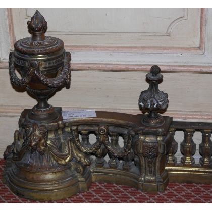  Paire de chenets Louis XVI en bronze sur  Moinat SA  - Antiquités décoration