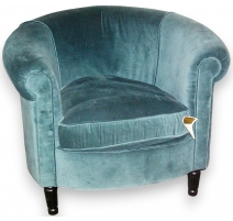 Fauteuil recouvert de velours bleu-vert