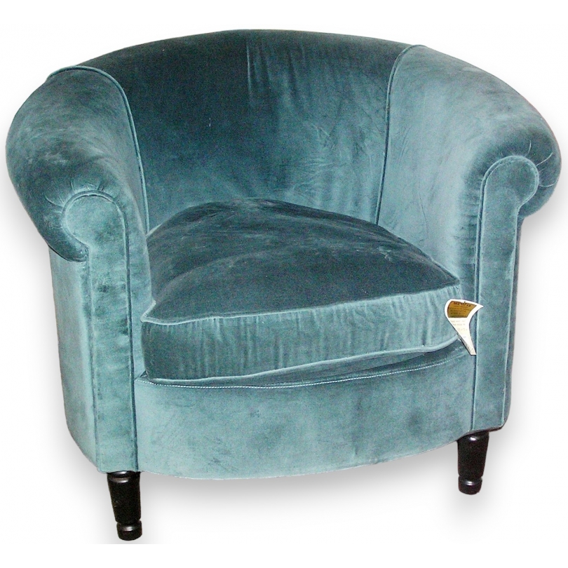 Fauteuil recouvert de velours bleu-vert