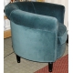 Fauteuil recouvert de velours bleu-vert