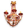 Red and gold wrought-iron chandelier at  Moinat SA  - Antiques and home décor