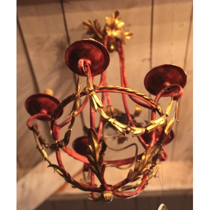 Red and gold wrought-iron chandelier at  Moinat SA  - Antiques and home décor