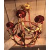 Red and gold wrought-iron chandelier at  Moinat SA  - Antiques and home décor