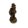 Porcelain statue of a boy by Capo, available from Moinat SA – Antiques and home décor