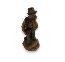 Statue d'une garçon en porcelaine Capo