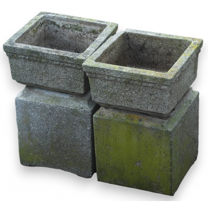 A pair of square plinths, made of moulded stone. From  Moinat SA  - Antiques and Decor