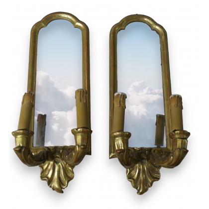  Paire d'appliques-miroirs en bois doré sur  Moinat SA  - Antiquités décoration