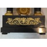 Empire-style clock with wooden columns at  Moinat SA  - Antiques and home décor