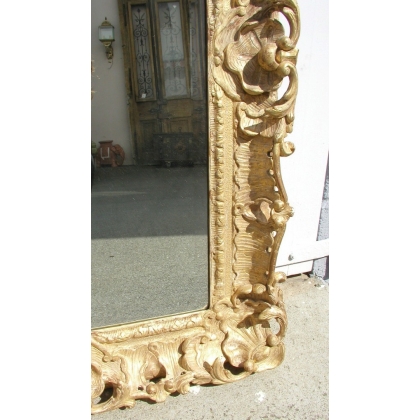 Espejo de estilo Regencia, tallado y dorado. En Moinat SA - Antigüedades y decoración