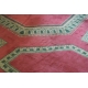 Tapis à angles coupés rouge et vert,