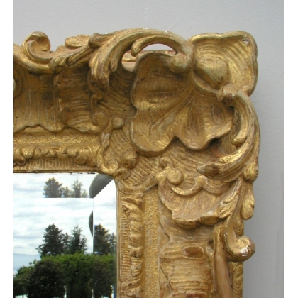 Espejo de estilo Regencia, tallado y dorado. En Moinat SA - Antigüedades y decoración
