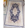  Tapis persan beige et bleu sur  Moinat SA  - Antiquités décoration