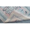 Persian rug with a pink background at  Moinat SA  - Antiques and home décor