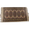  Tapis décor bleu sur fond beige sur  Moinat SA  - Antiquités décoration