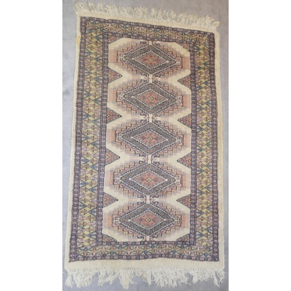  Tapis décor bleu sur fond beige sur  Moinat SA  - Antiquités décoration