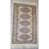  Tapis décor bleu sur fond beige sur  Moinat SA  - Antiquités décoration