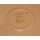 Plat rond, en céramique, signé BOAS