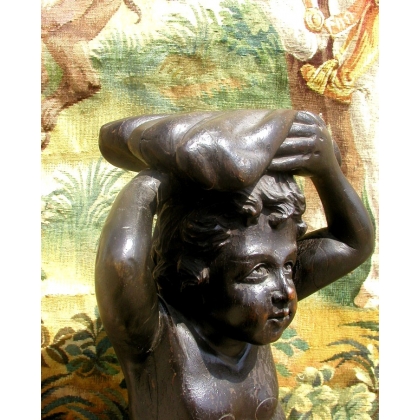 Sculpture entitled ‘Child and Dolphin’. At Moinat SA – Antiques and Decorative Arts