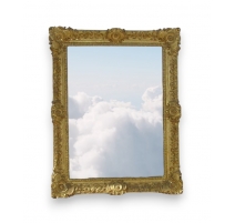 Miroir Regence sculpté et doré.