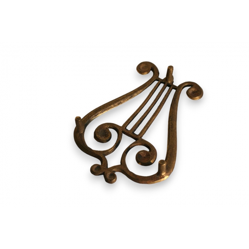 Lyre-shaped iron rest at  Moinat SA  - Antiques and home décor