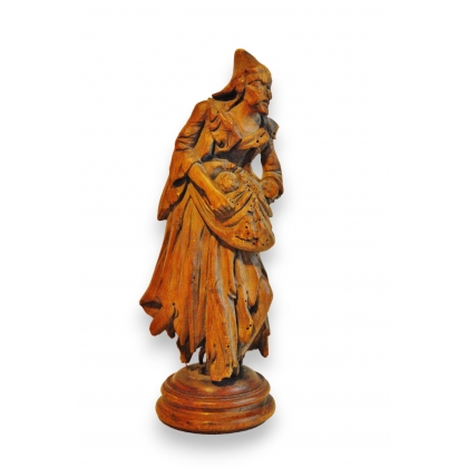 Statuette \"Le colporteur\" en bois