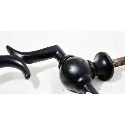 Black cast-iron door knocker at  Moinat SA  - Antiques and home décor