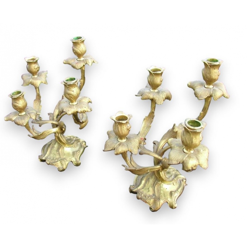 Pair of Louis XV-style candlesticks. Available from  Moinat SA  - Antiques and home décor