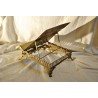 "IHS" bookend, in openwork brass, from  Moinat SA  - Antiques and home décor