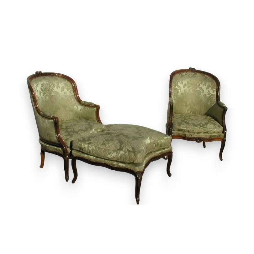 A pair of Louis XV wing chairs with one footrest. From  Moinat SA  - Antiques and home décor